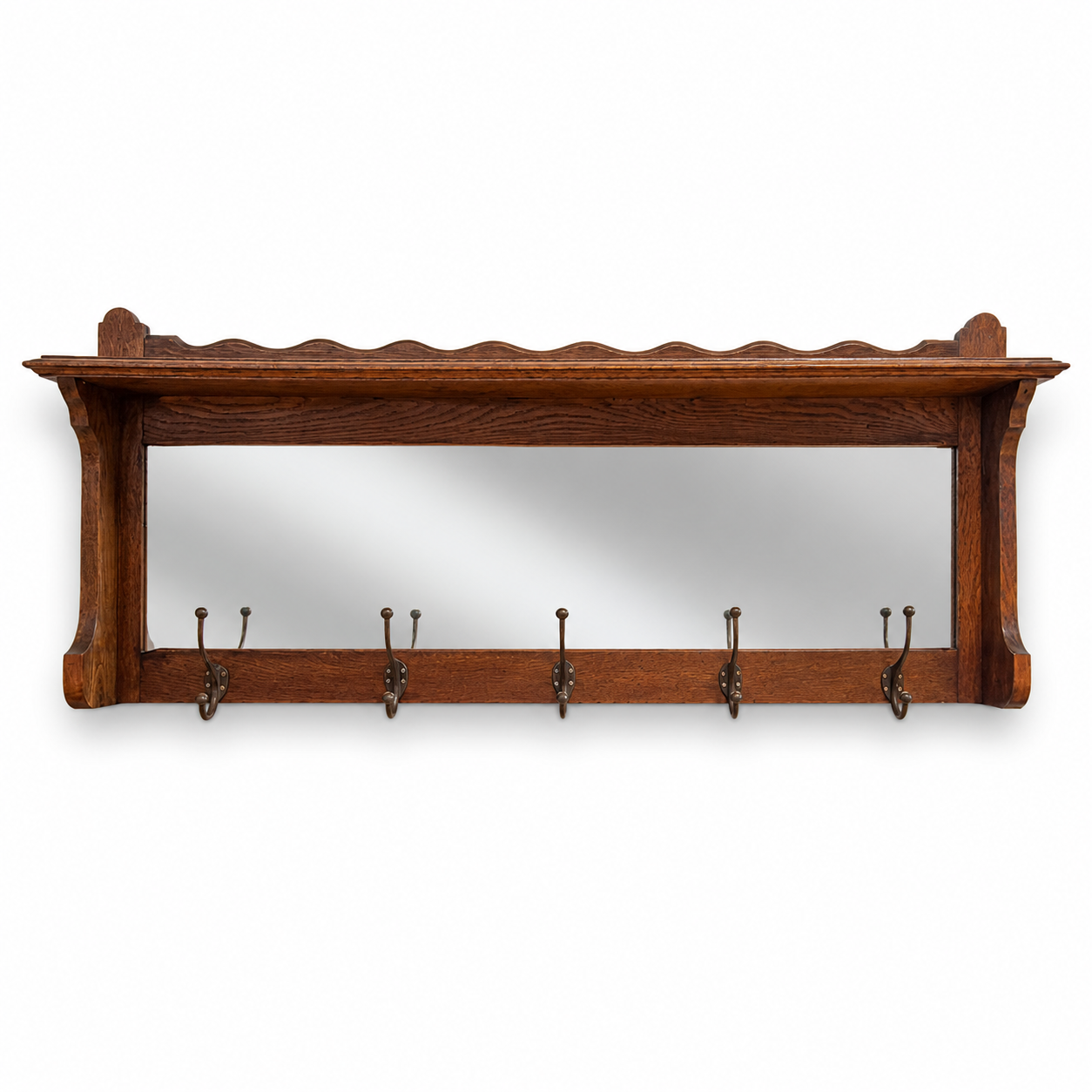 Front view of antique oak hall rack with mirror and coat hooks