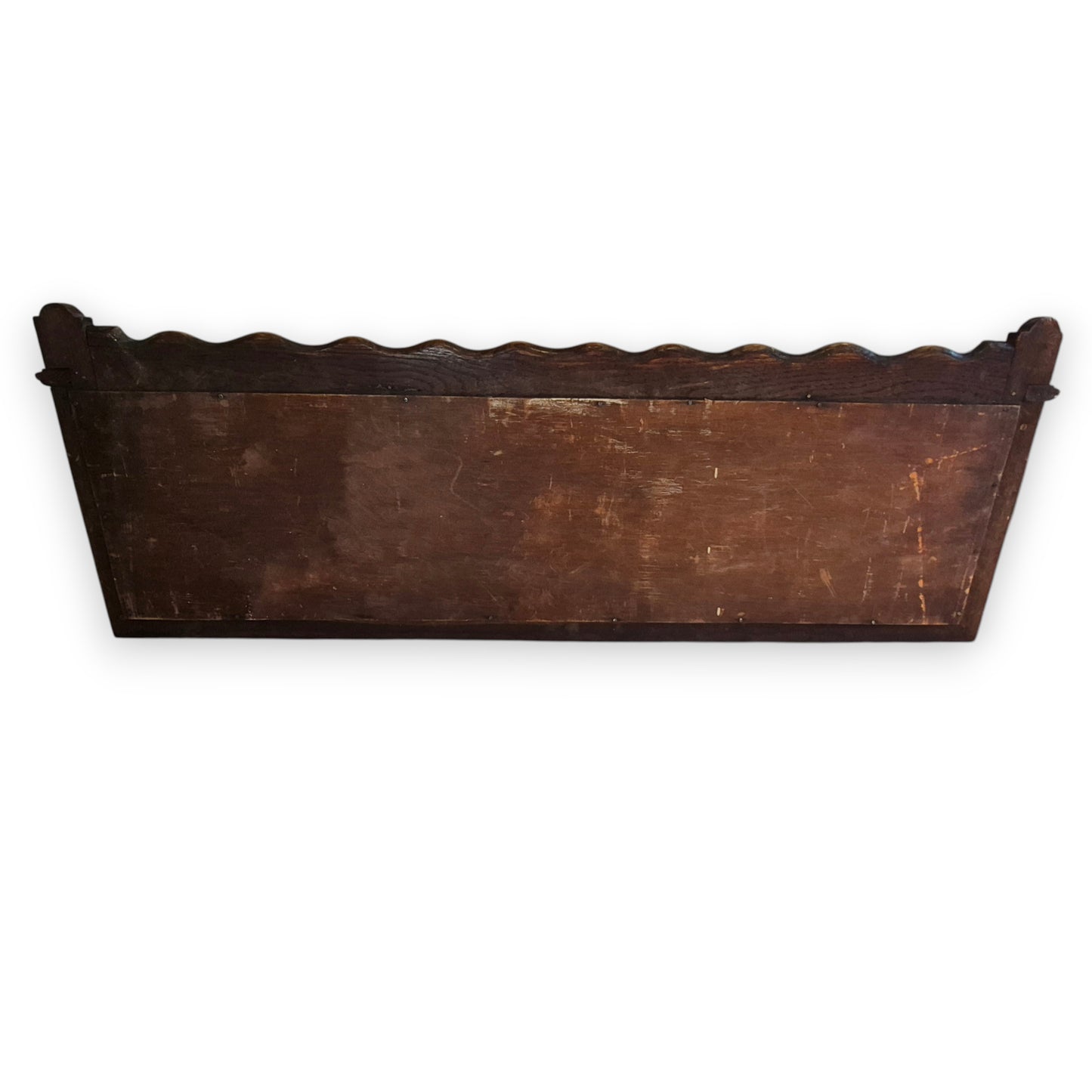 Rear view of antique oak hall rack with mirror and coat hooks