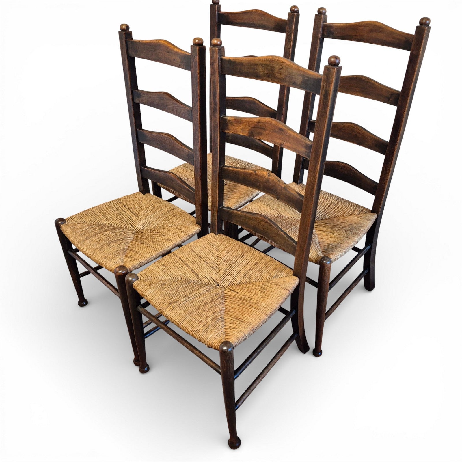 Antique oak ladderback chairs with rush seats