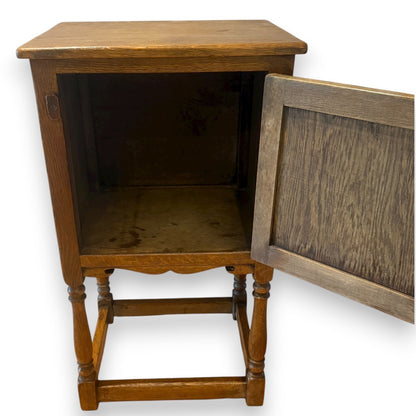 Solid oak linenfold cupboard – door open showing interior storage space