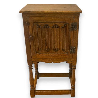 Antique solid oak cupboard with carved linenfold door