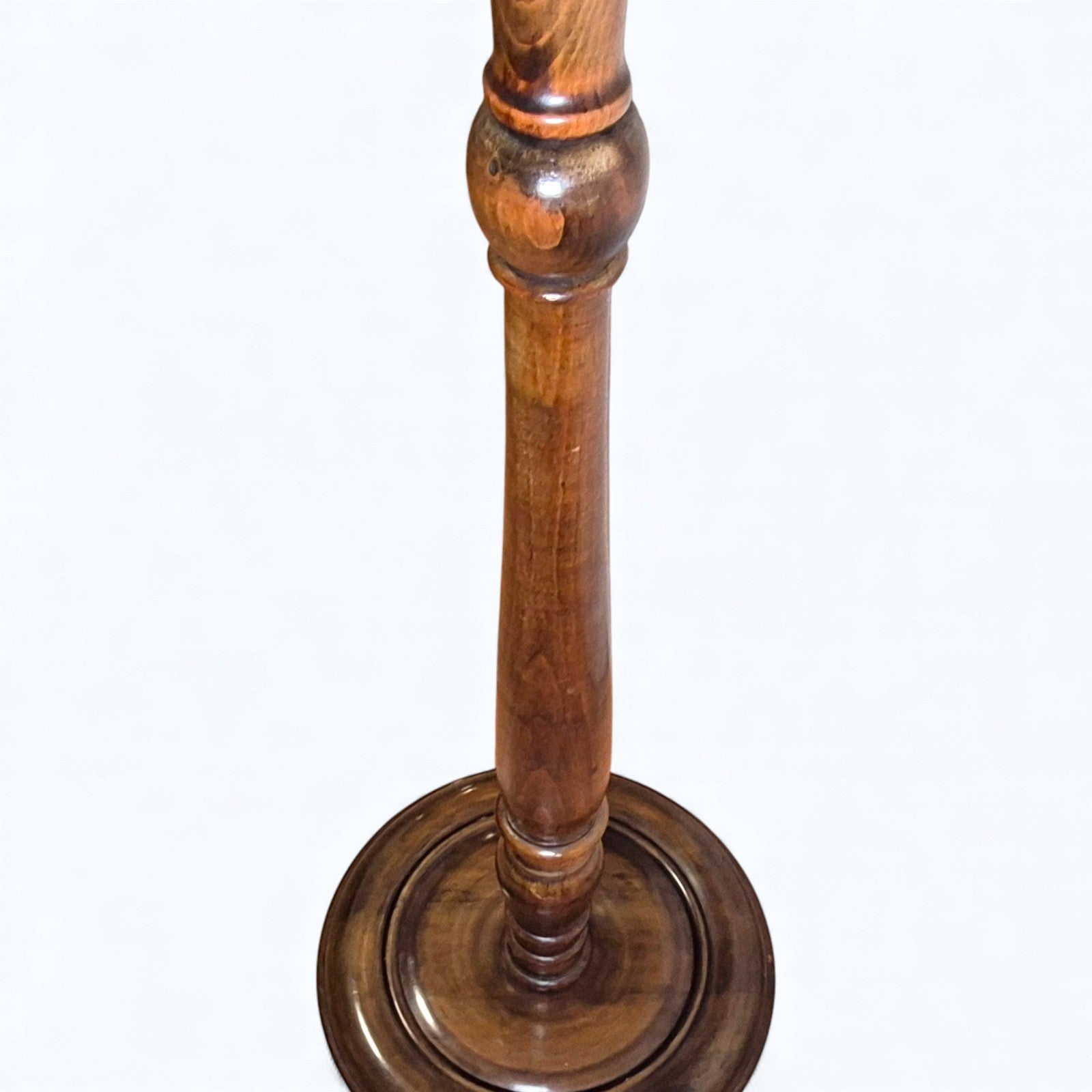 Detail of turned oak column on antique standard lamp