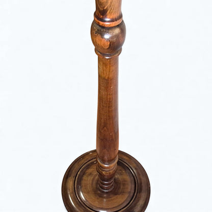 Detail of turned oak column on antique standard lamp