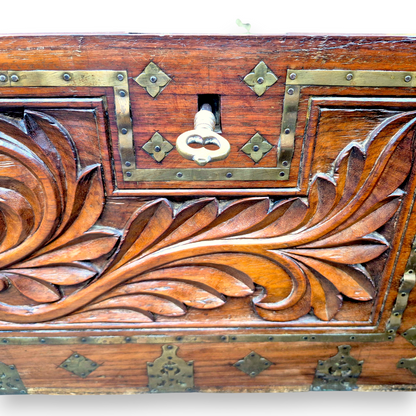 Carved foliate front panel on antique padouk storage chest
