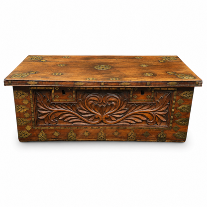 Antique padouk blanket box with carved front and decorative brass mounts