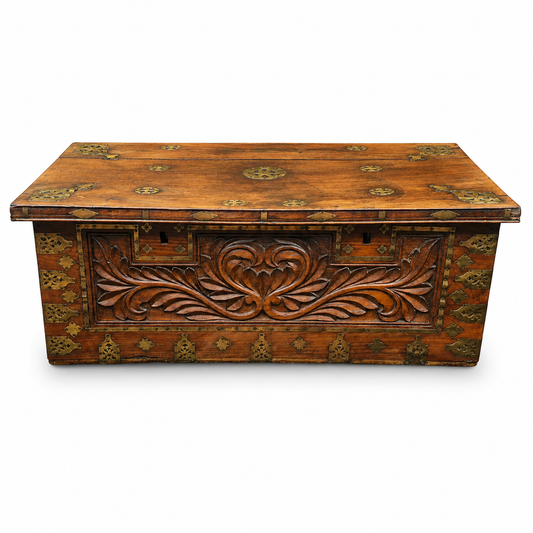 Antique padouk blanket box with carved front and decorative brass mounts