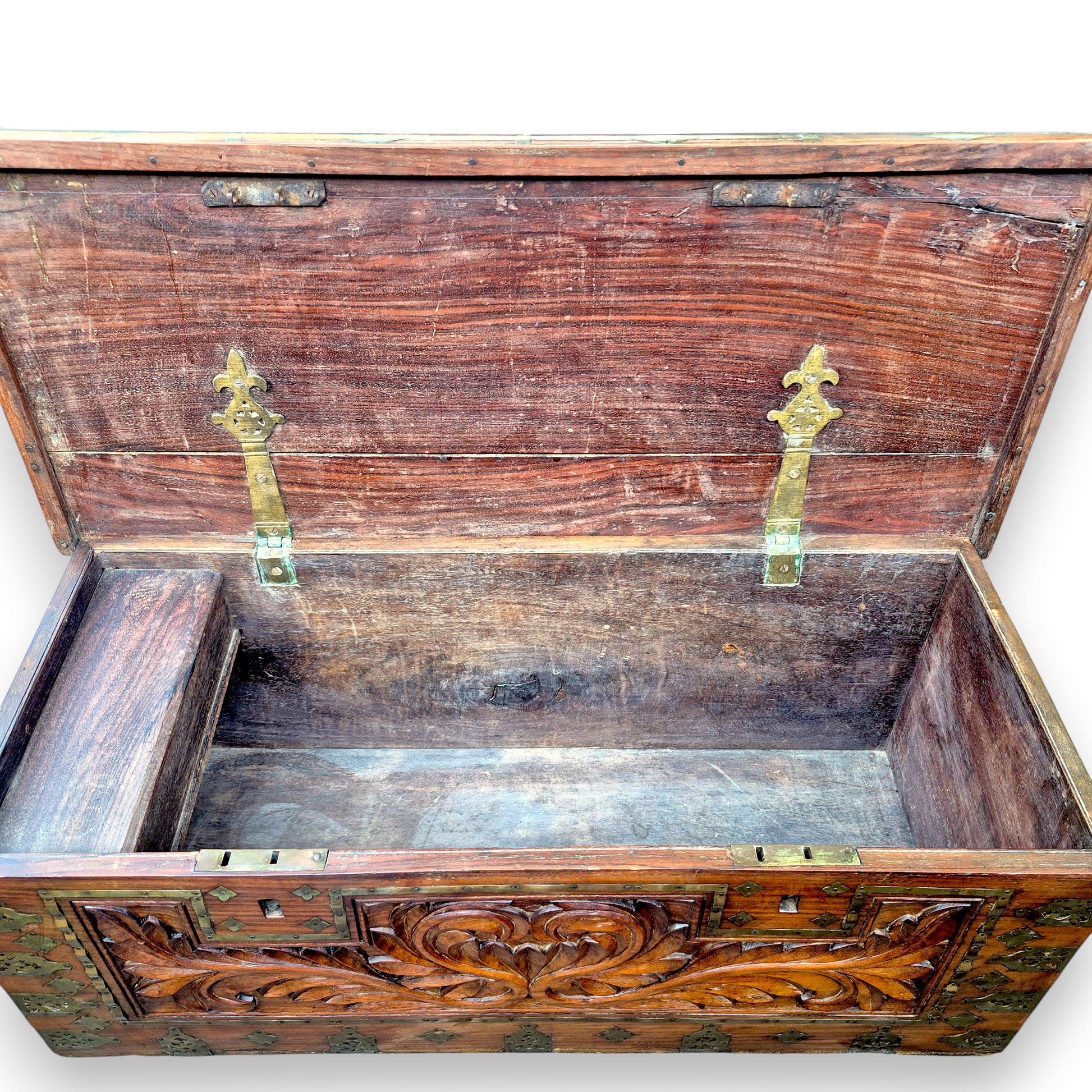 Open antique blanket box showing spacious wooden interior