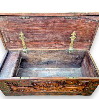 Open antique blanket box showing spacious wooden interior
