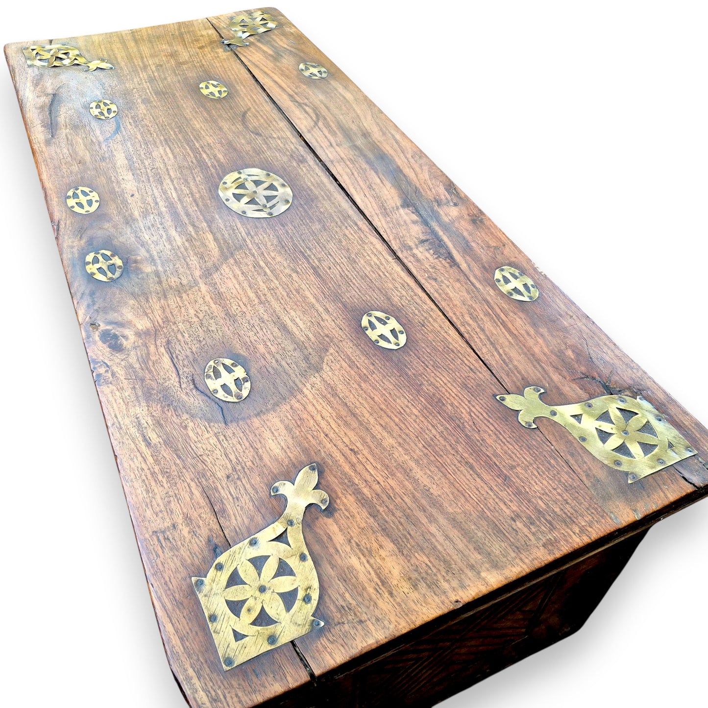 View of lid from antique padouk blanket box with decorative brass fittings