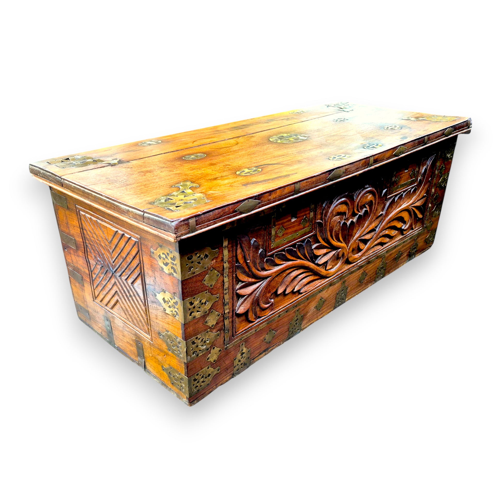 Antique padouk blanket box with carved front and decorative brass mounts