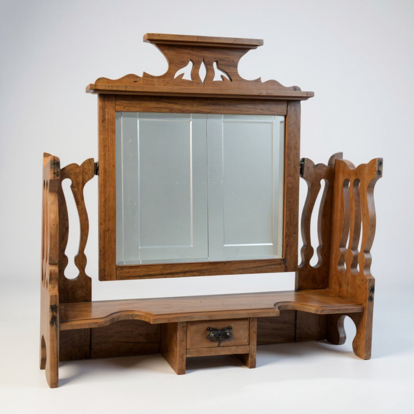 Rustic pine mirror – angled view highlighting warm patina and carved details