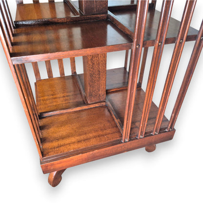 Edwardian mahogany revolving bookcase with open book storage compartments