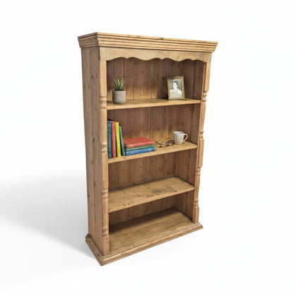 Rustic pine bookcase – angled view highlighting turned supports and aged finish