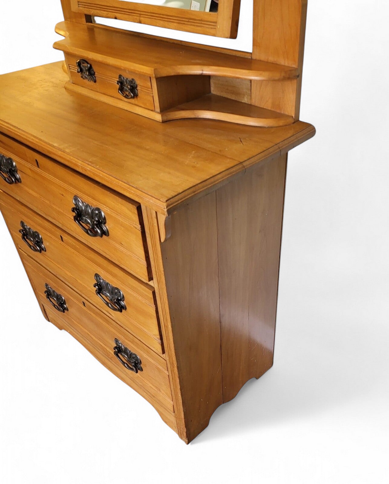 Close-up of satin walnut grain and patina on antique Victorian dressing table