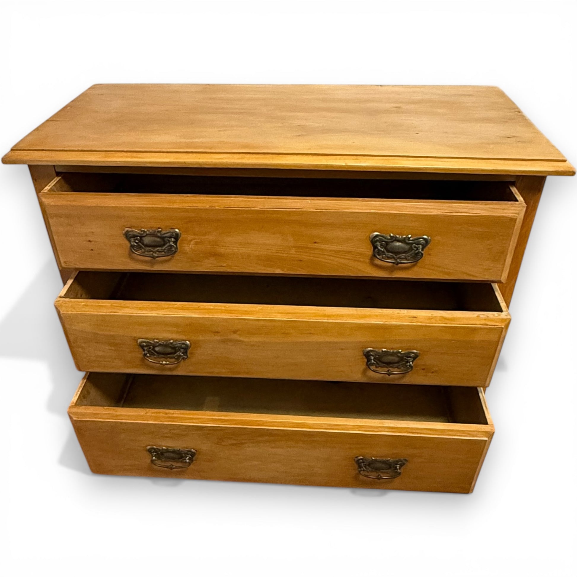 Antique stripped pine chest with three drawers and traditional proportions