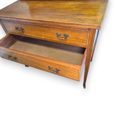 Mahogany veneer Edwardian dressing table drawer detail with decorative inlay-style border and handle