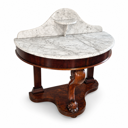 Victorian marble-top washstand with a shaped splashback and small raised marble shelf.