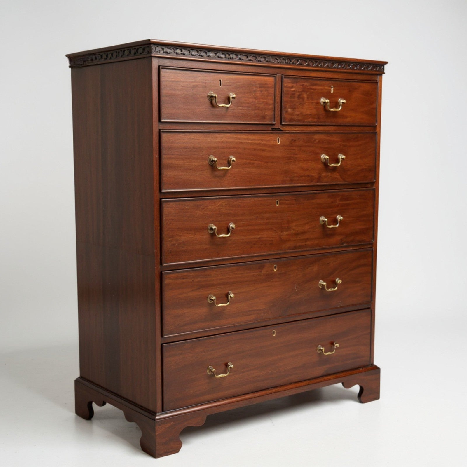 Victorian mahogany tallboy – angled view highlighting rich patina and brass handles