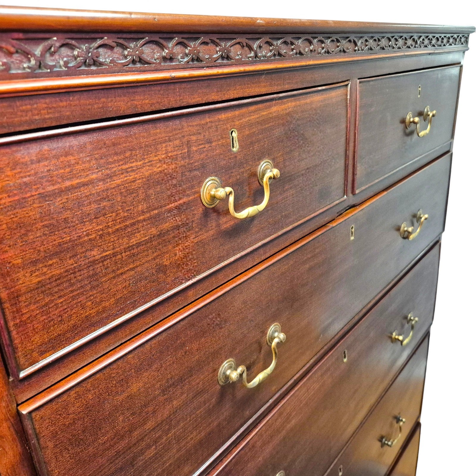Mahogany tallboy – close-up of brass swan-neck handles and escutcheons