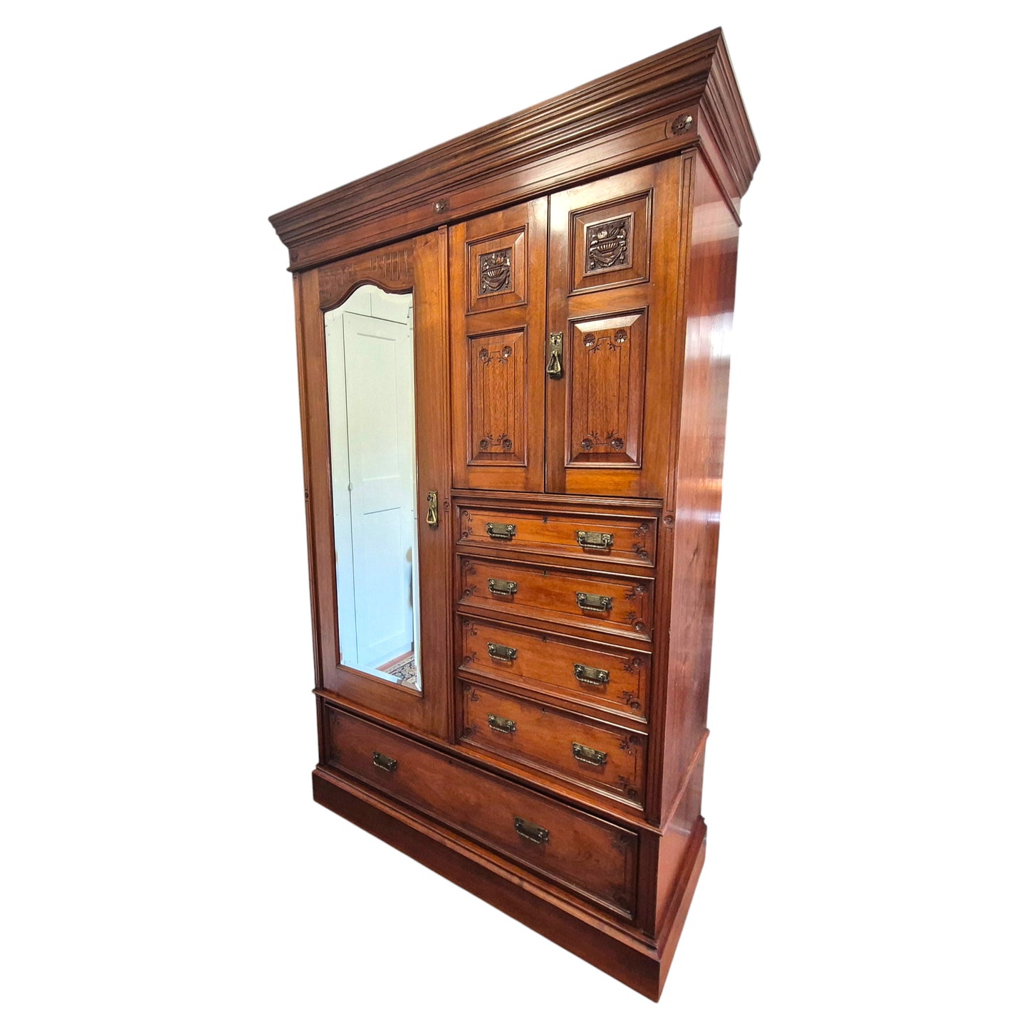 Antique compactum wardrobe interior showing sliding linen trays, open cupboard doors and fitted drawers
