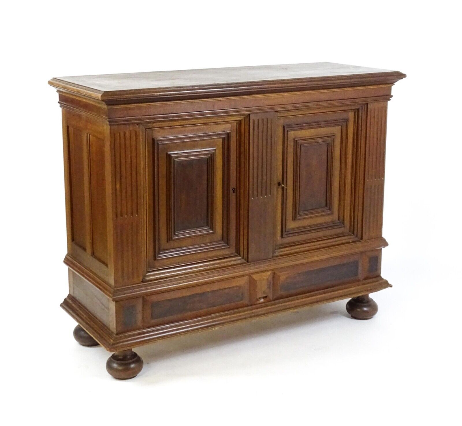 Antique walnut cupboard with fluted frame and long drawer, late 19th century