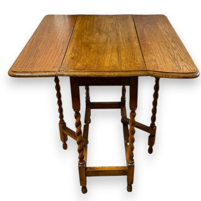 Close-up of barley twist legs and stretcher base on antique oak table
