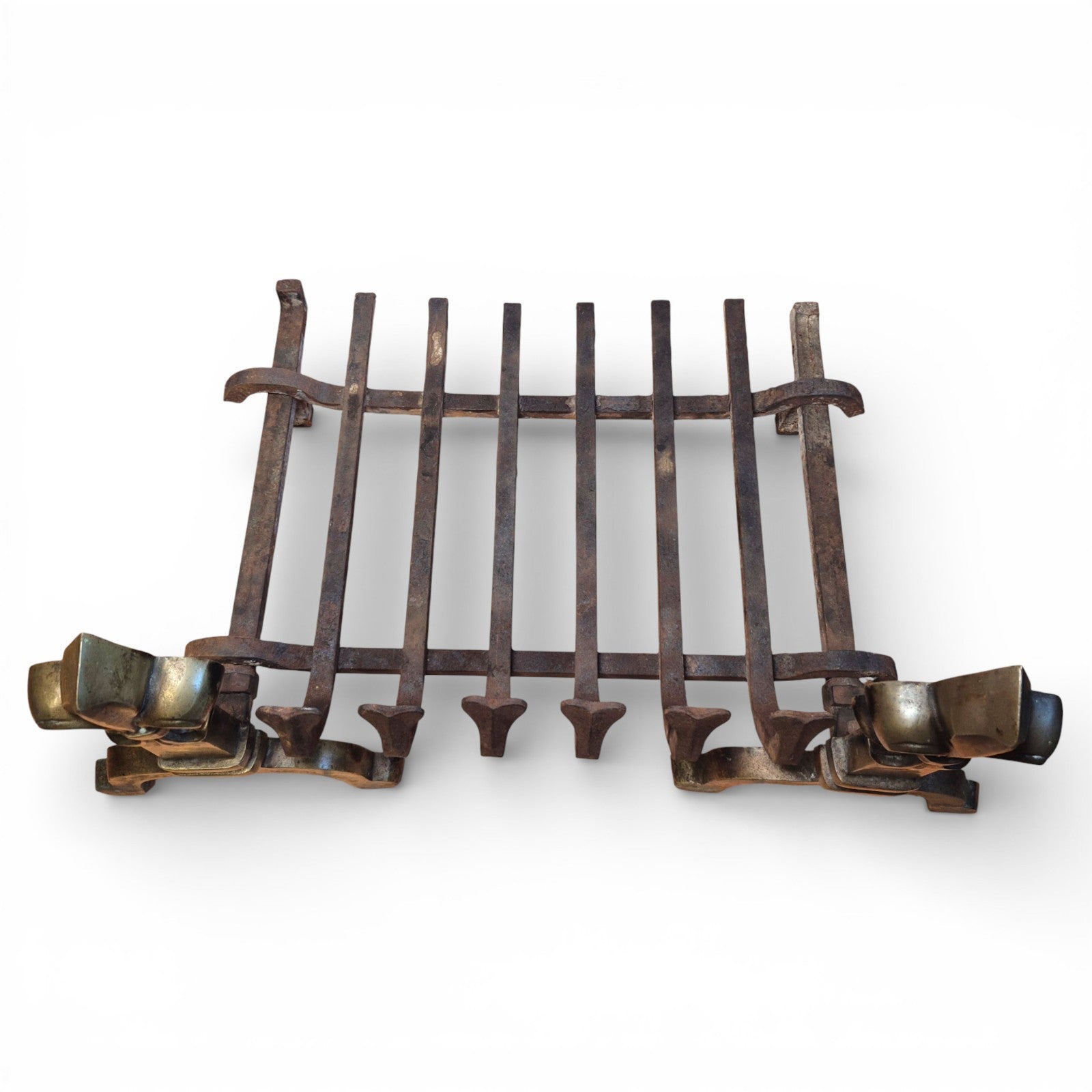 Cast iron hearth basket on antique fireplace grate