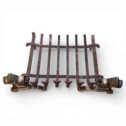 Cast iron hearth basket on antique fireplace grate