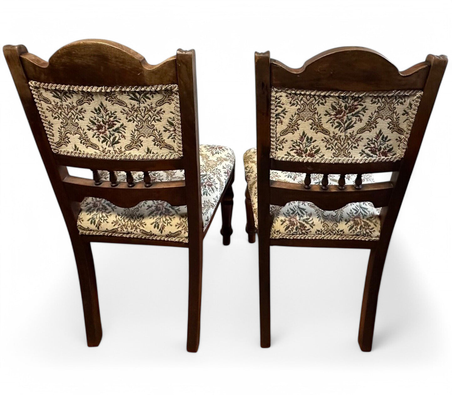 Rear view of Edwardian mahogany low chairs with traditional frame design and smooth aged finish.
