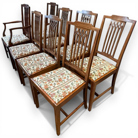 Set of eight Edwardian inlaid mahogany dining chairs with carvers angled view