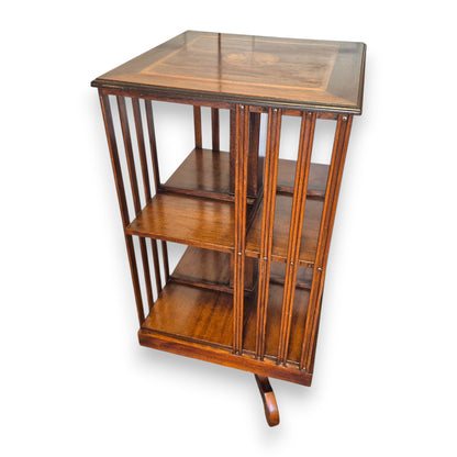 Antique revolving library bookcase showing mahogany shelves and revolving base