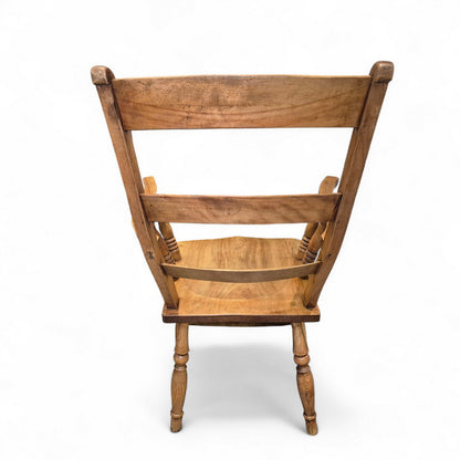 Back view of antique ladder-back country chair