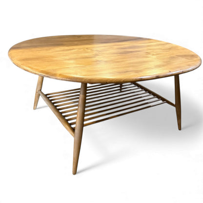 Side angle of vintage Ercol 454 blonde table showing mid-century profile