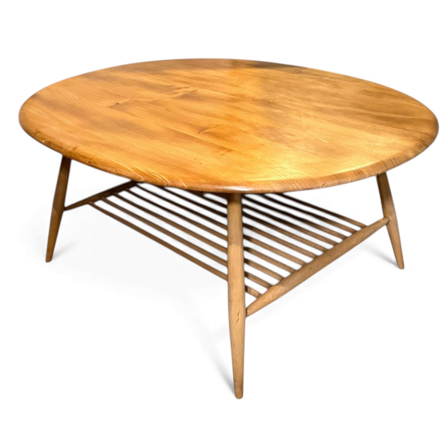 Mid-century Ercol 454 coffee table showing blonde elm grain and curved edges