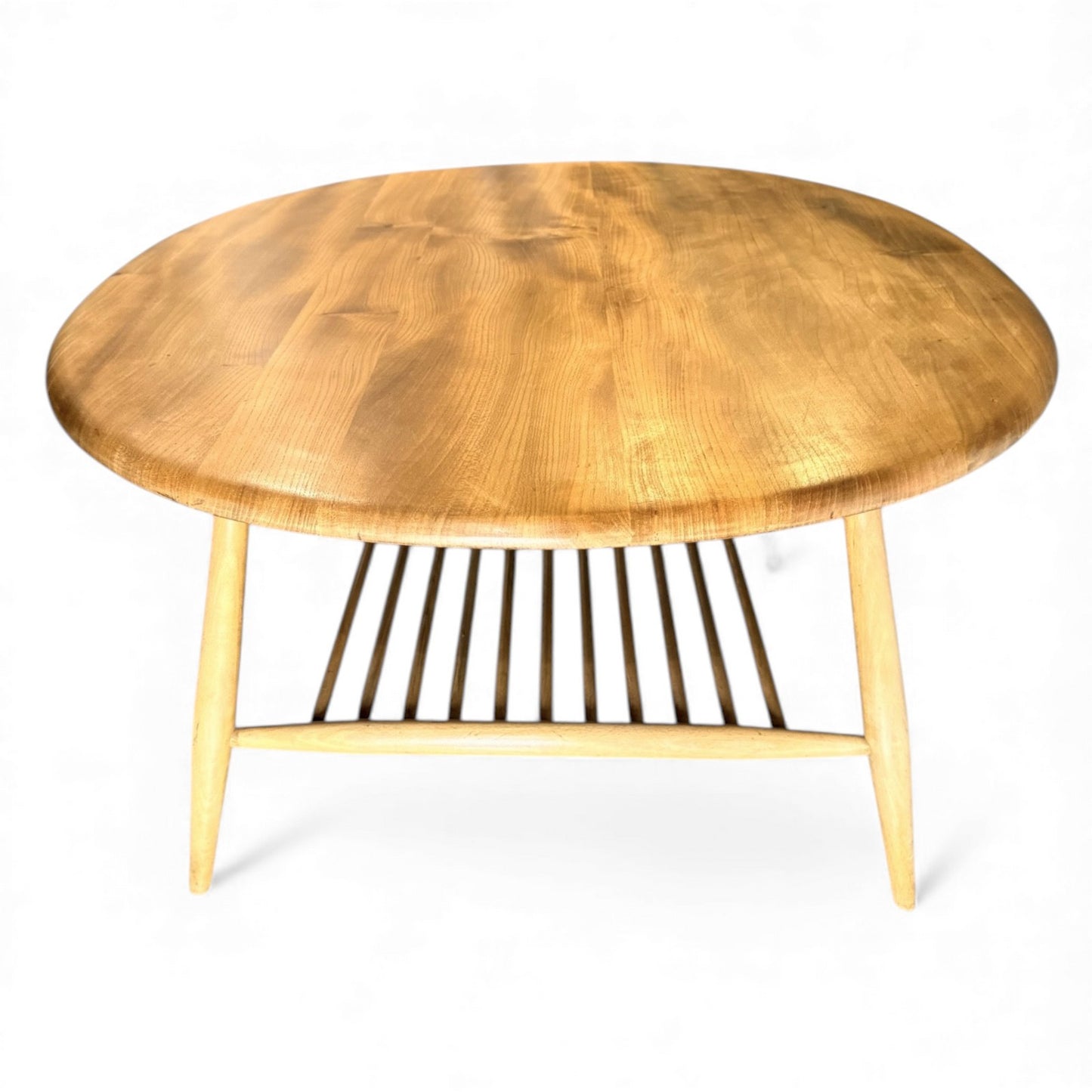 Mid-century Ercol 454 coffee table showing blonde elm grain and curved edges