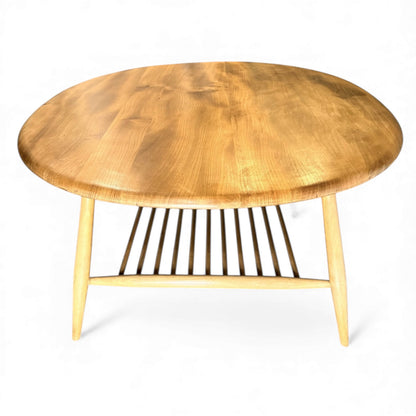 Mid-century Ercol 454 coffee table showing blonde elm grain and curved edges