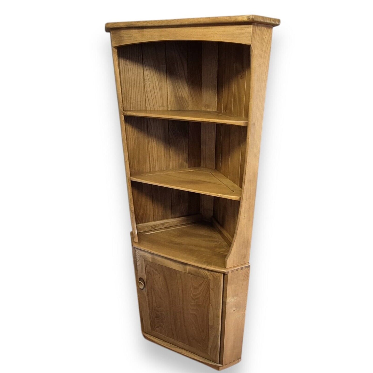 Ercol elm corner cabinet – angled view highlighting warm grain and craftsmanship