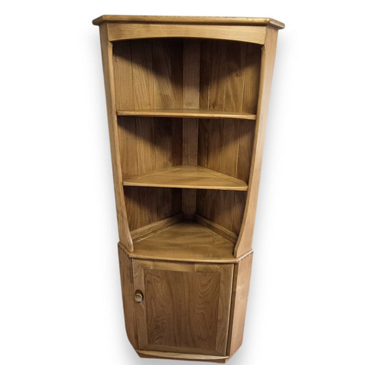 Ercol mid-century English elm corner cupboard – front view showing open shelves and cabinet