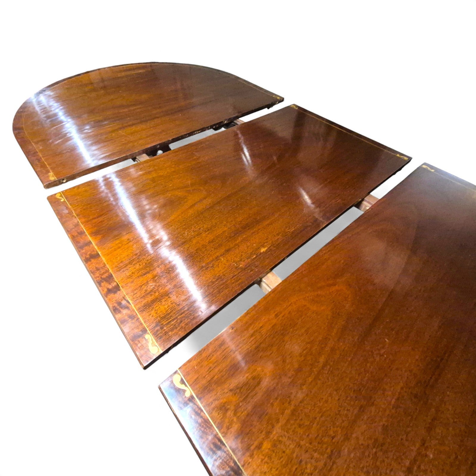 Extending dining table shown with centre leaf and rails