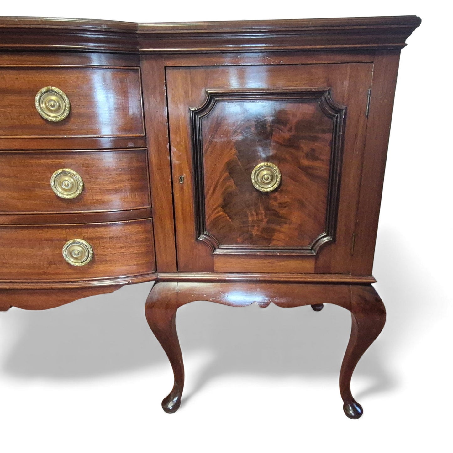 Close-up of flame-mahogany door panels on antique sideboard