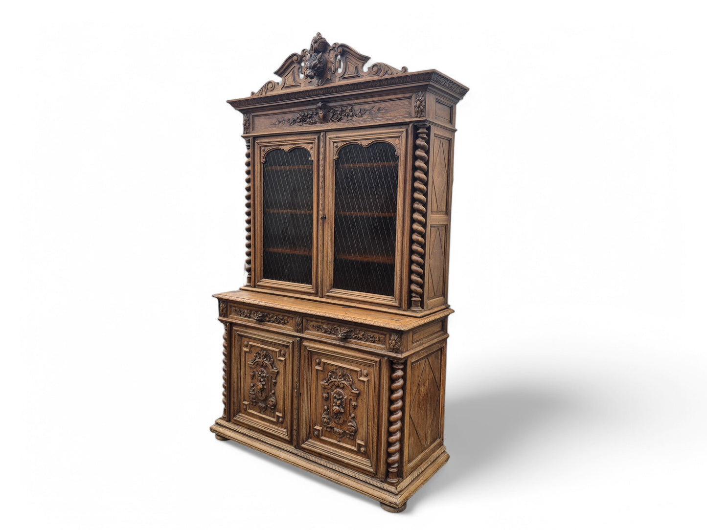 Full front view of antique French oak dresser showing ornate carvings and rich patina