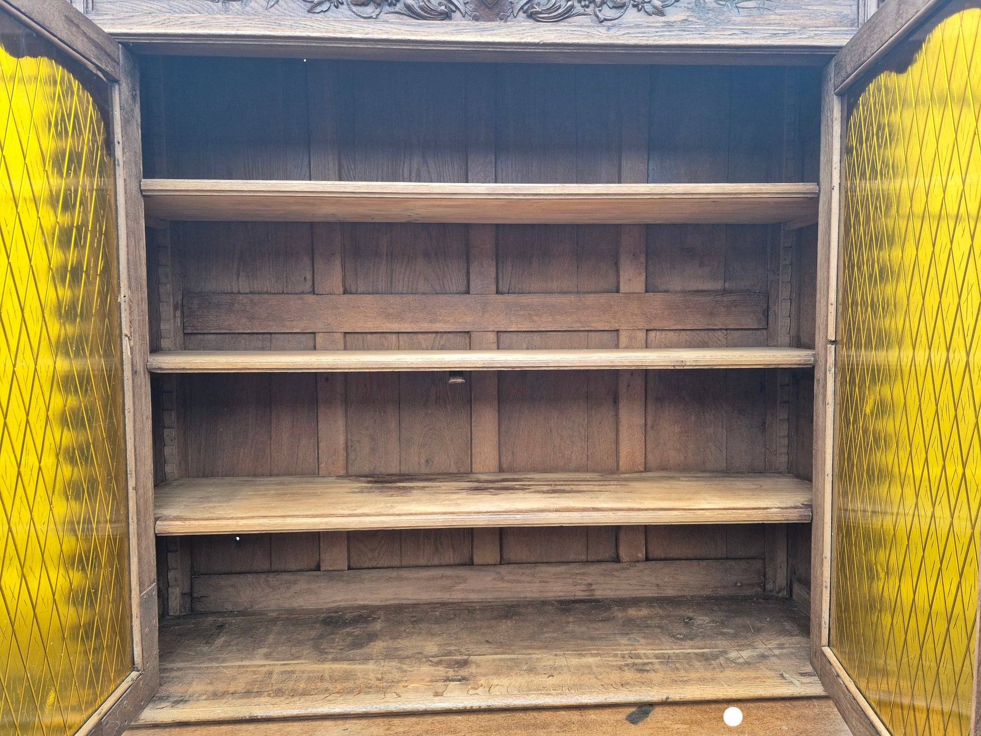 Interior shelves of antique French oak dresser – ample storage and display space