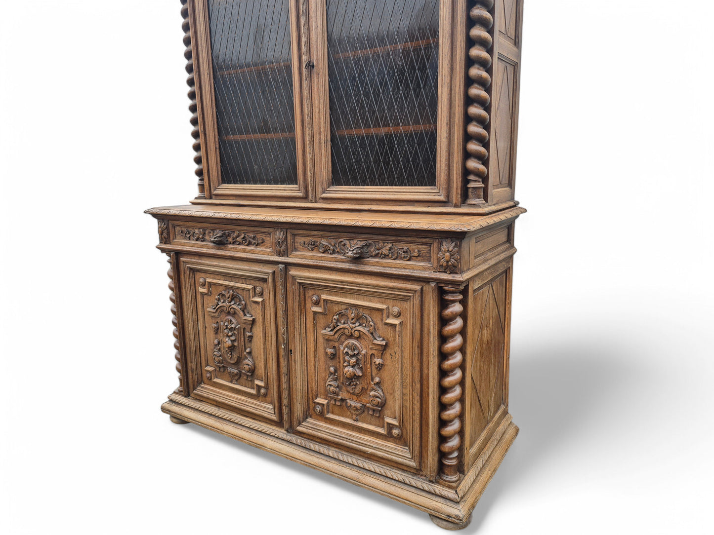 Twisted column detail on antique French oak dresser – ornate craftsmanship