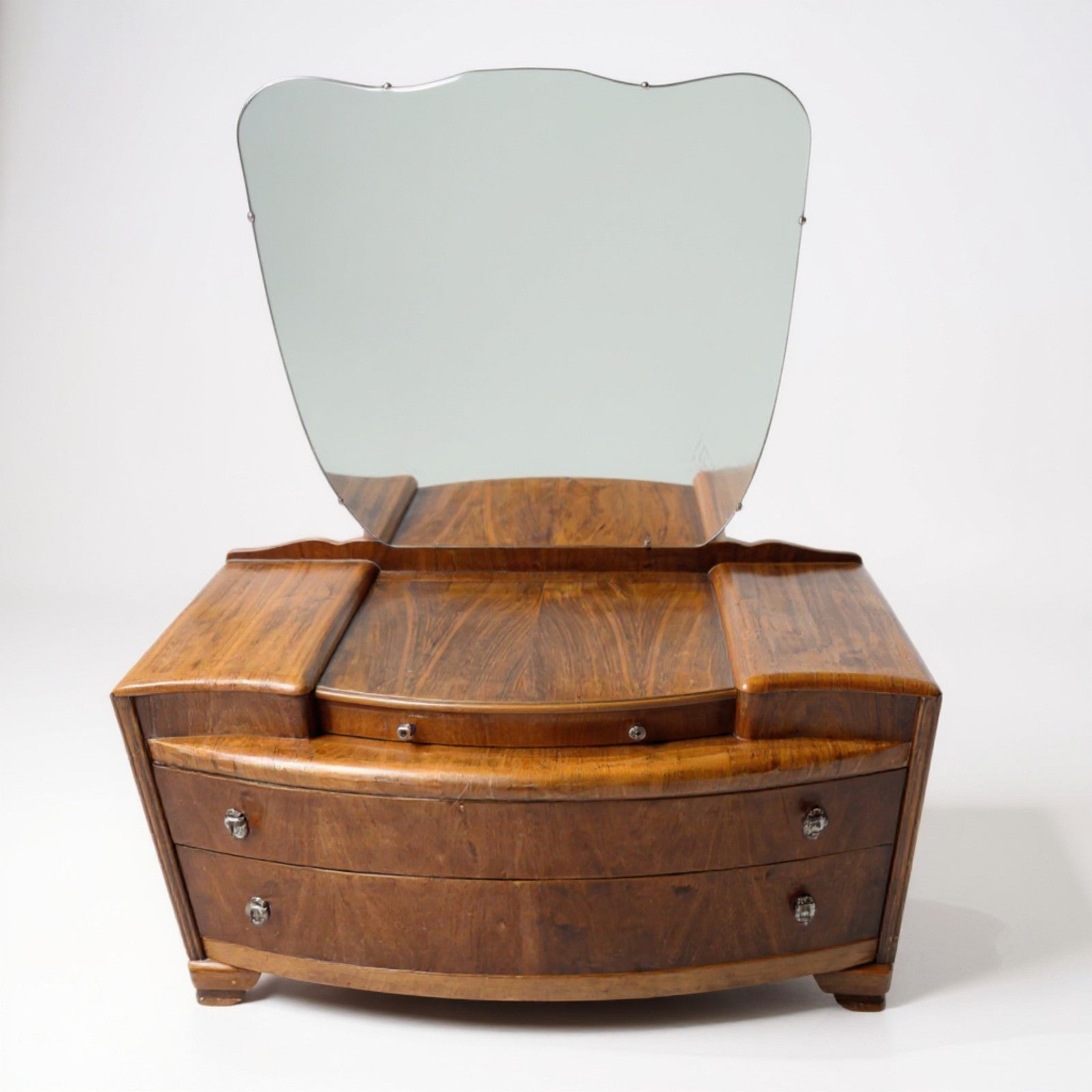 Front view of Art Deco dressing table showing walnut veneer grain and mirror shape