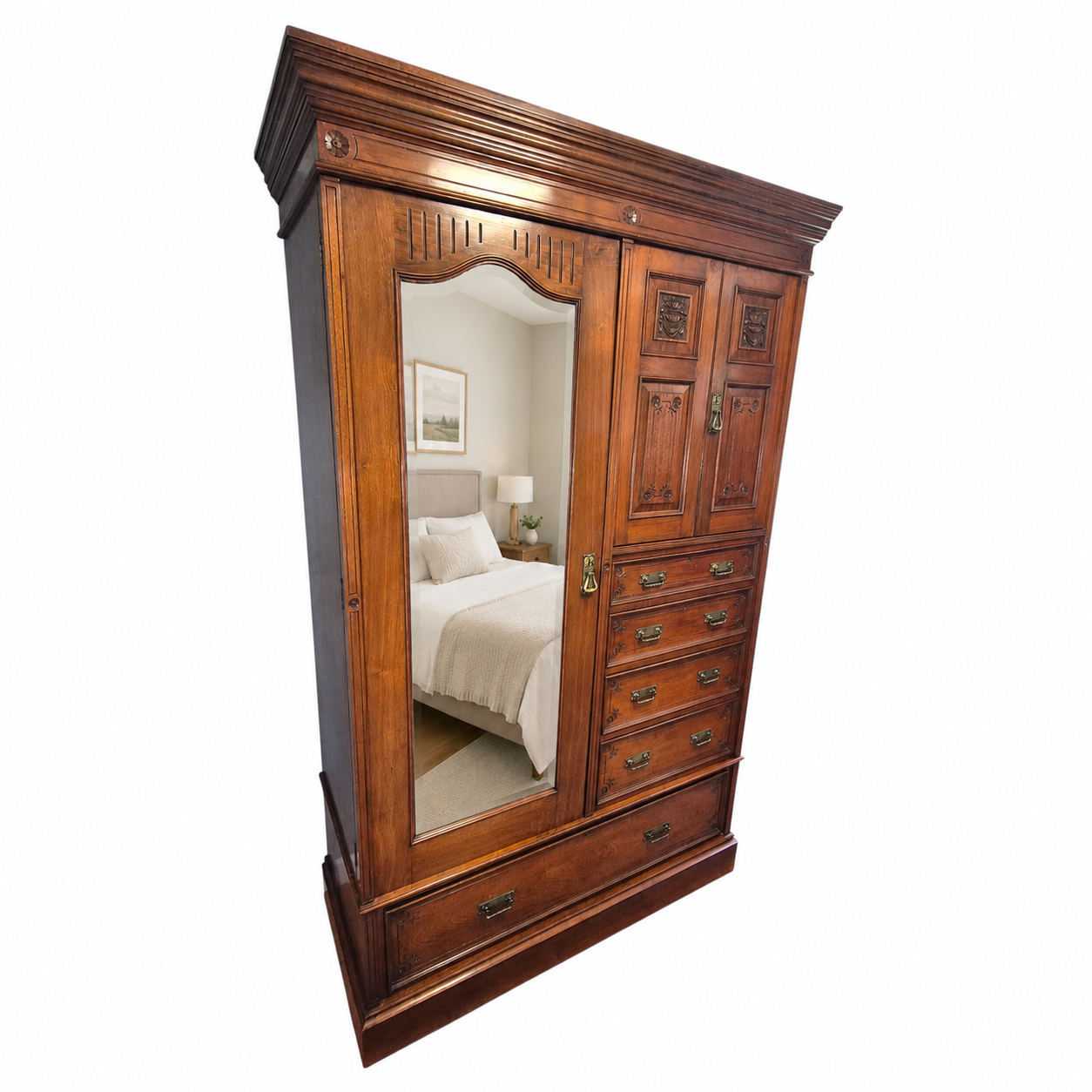 Victorian walnut bedroom wardrobe with brass handles, carved cupboard doors and large lower storage drawer