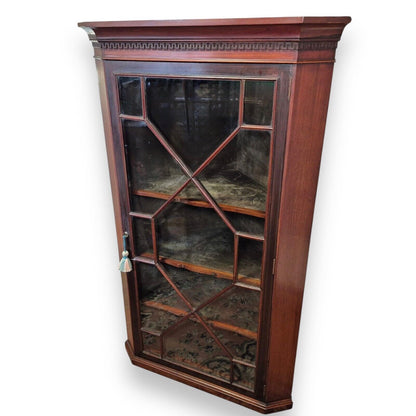 Georgian mahogany cabinet – angled view highlighting dentil frieze and rich patina