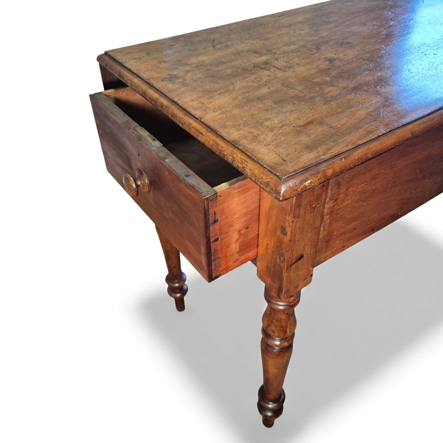 Close-up of mahogany drawer with turned wooden knob handle