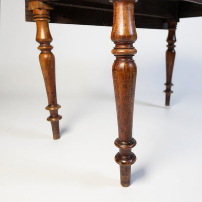 Leg detail of antique Georgian mahogany console table with drawer and drop leaf