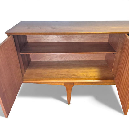 Interior of double-door cupboard with shelf