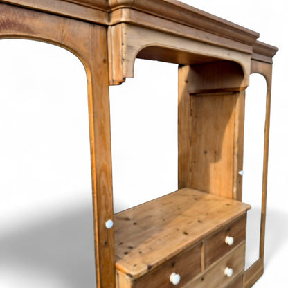 Large vintage pine double wardrobe showing natural grain and porcelain knobs